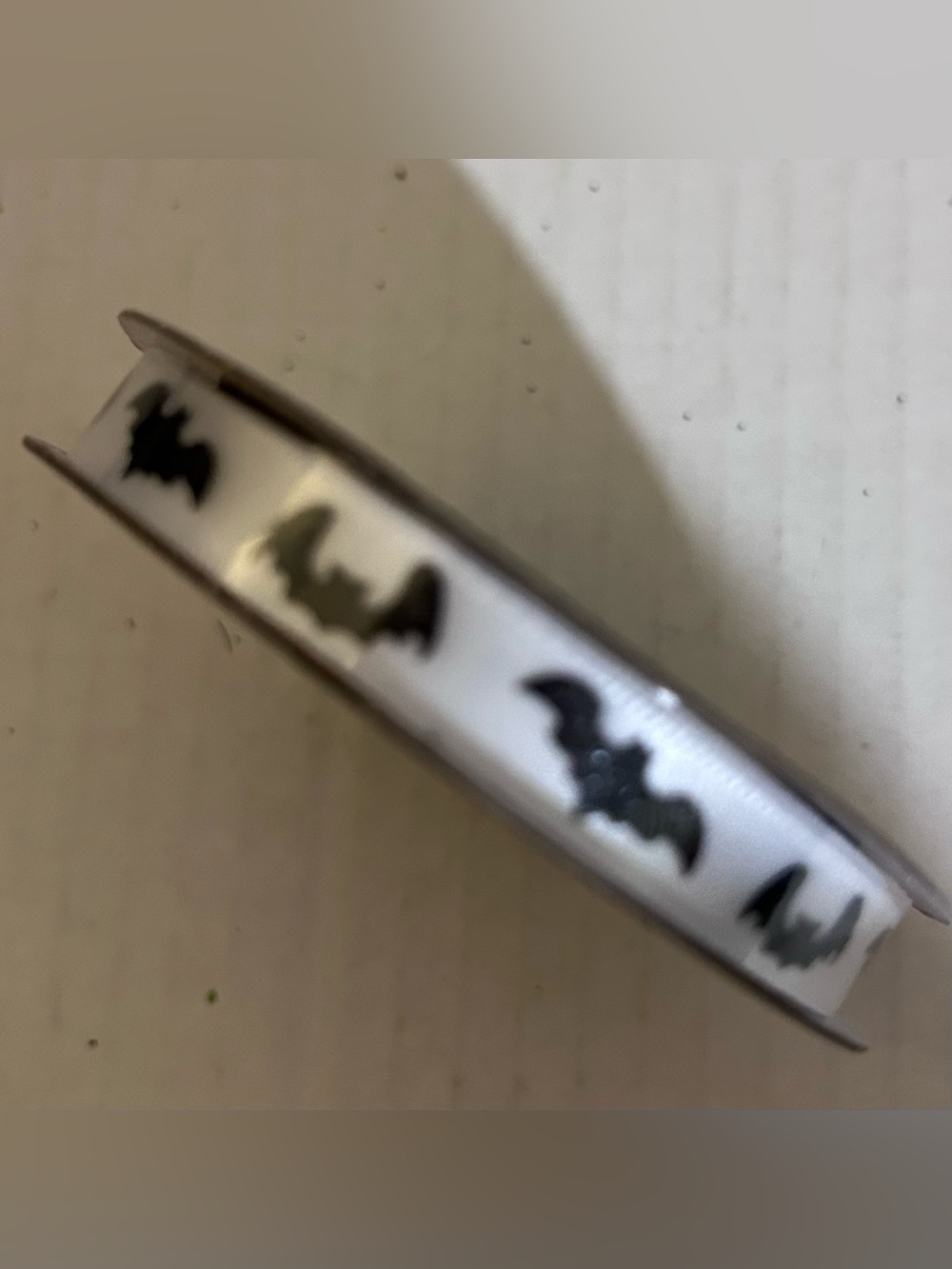 Celebrate it white ribbon with black bat print 3/8”